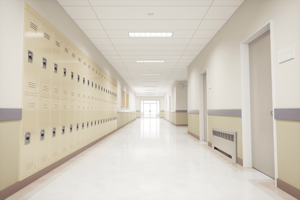 Front view of a convector unit installed in a school hallway