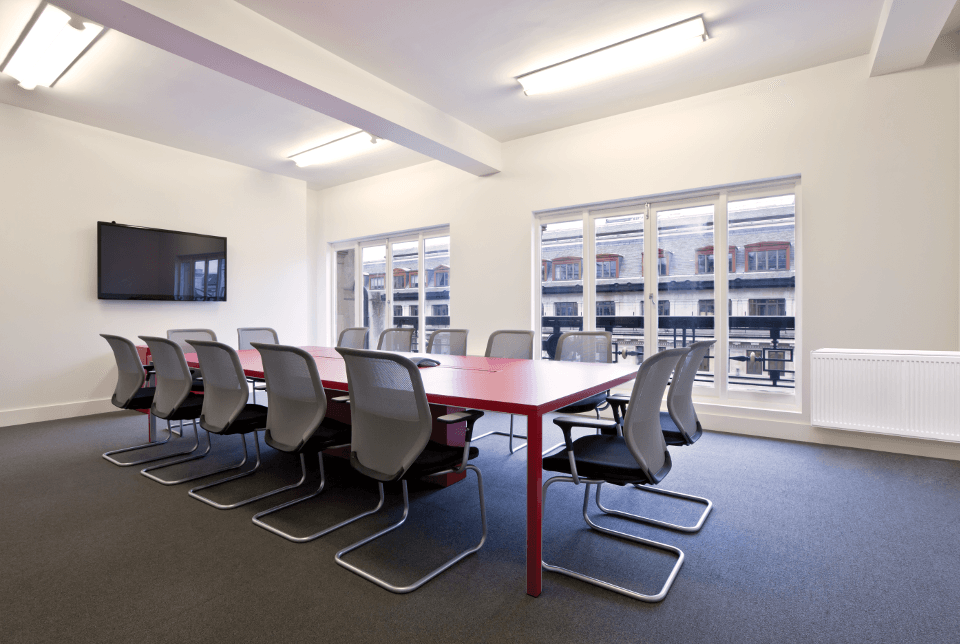 Panel radiator in a large office's conference room