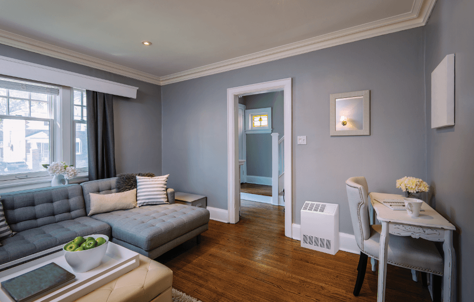 Surface Twin Flo wall unit placed in the living room for heating and comfort